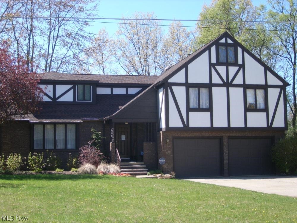 Check out this stunning Tudor home located in Amherst, Ohio. It features 4 bedrooms, 4 baths, and over 4000 sqft of living space.
One highlight of this property is the finished basement with a kitchen and separate home access. Perfect for hosting guests or even as an in-law suite. You'll also love the all seasons room with a walk-out balcony that faces a serene stream. It's the perfect spot to relax and enjoy nature's beauty. The principal suite is a true oasis, with an adjacent office for those work-from-home days. And let's not forget the spacious walk-in closet and a massive bathroom complete with a jacuzzi tub and skylights for that natural glow.
This home has it all! Don't miss out on this incredible opportunity.