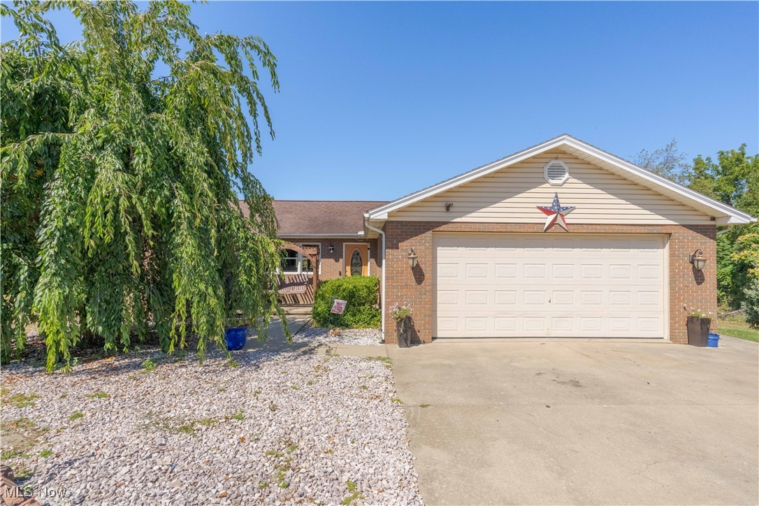 Sitting on 3.47 acres of serene countryside, this updated home offers a perfect blend of comfort an modern amenities. Built in 2002, this property features 3 bedrooms, 2.5 baths, and the potential for a fourth bedroom and bath, with plumbing already in place. Enjoy the outdoors with an above-ground swimming pool with a deck and a 24/32 pole barn, ideal for hobbies or storage. Inside, the home boasts custom kitchen aid cabinets with modern appliances, included with the sale, and a breakfast bar, perfect for casual dining. The spacious master suite includes a huge walk-in closet and an updated bathroom. Vaulted ceilings and a gas fireplace add to the home's charm, while recessed lighting enhances the ambiance throughout. Additional features include a walk-out basement, first-floor laundry, and a partially finished basement with ample storage. The property sits back off the road, ensuring privacy and tranquility. Updated with a heat pump for energy efficient AC in 2023, the hot water tank replaced in 2016, and a new dishwasher in 2022, this home is move-in ready.