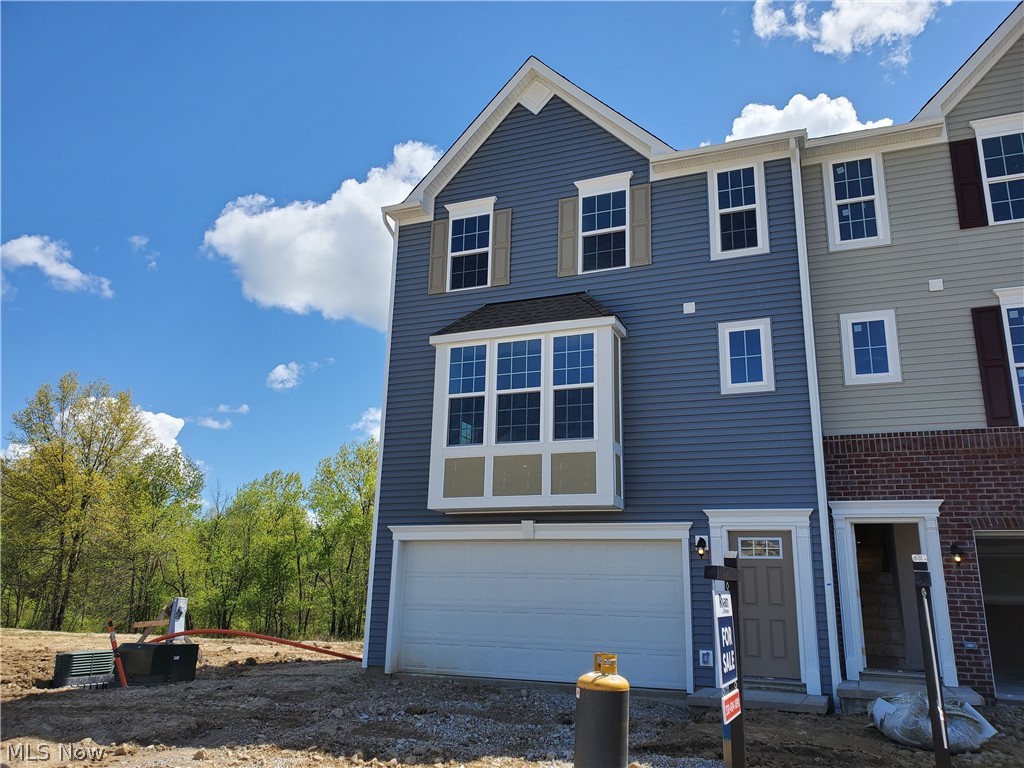 Whether you're looking for your first home or want brand new everything, you can find it at Towns at Steels Corners in Northern Cuyahoga Falls! Plus, with landscaping installed and lawn and snow care provided, spend more time doing the fun things in life and less of the work! Build your dream home in this easily accessible community with tree-lined and open space views set along a single cul-de-sac street! Plus, area shopping, restaurants, and recreation are conveniently close by! The Wexford townhome floorplan with open-concept main level provides a modern multi-level layout that adds excitement to daily living! An oversized kitchen island creates the perfect command center for cocktails and snacks, meal prep, or getting a little work out of the way! Upstairs you will find 3 bedrooms and the convenient laundry area. Your owner's suite has been outfitted for luxury with a wardrobe-sized walk-in closet and dual vanity en suite and a Roman shower with ceramic surround ! This end unit hom