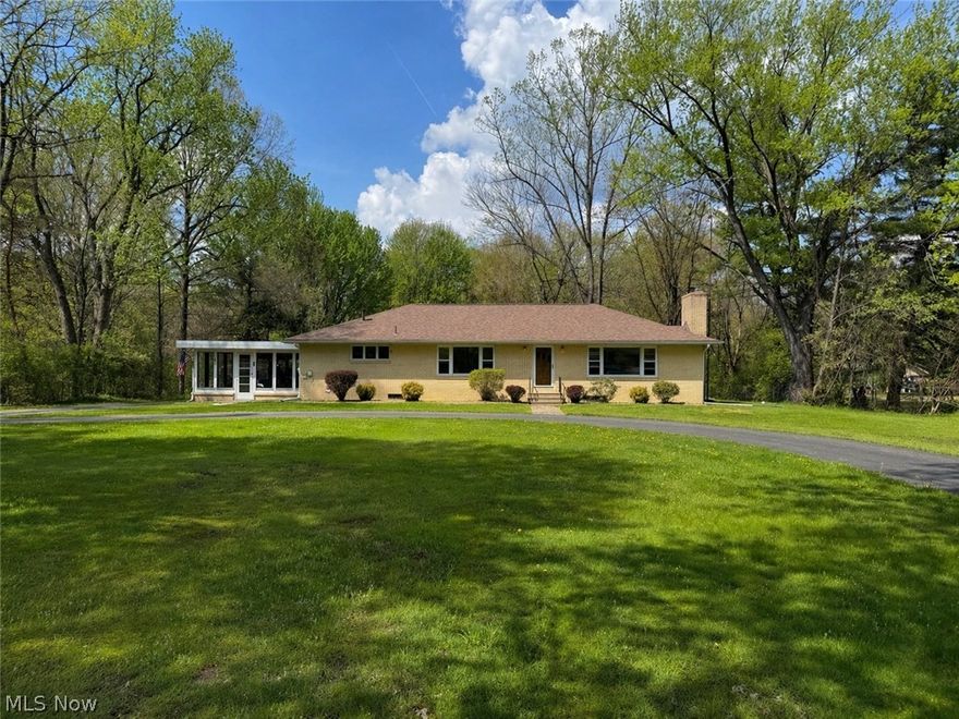 Welcome to this Stunning Brick Ranch positioned on 5 Private acres in the Lakeview School District! A don't Miss opportunity! North of 2,000 sq feet, this property features a Full wrap around Asphalt drive. The driveway continues to the back of home, meeting a privatized 2 car garage! 3 beds, 2 Full baths on the main level with a Full Master bath! The Main bathroom on main level was completely renovated with exceptional tile work in 2023! Kitchen leads into a formal dining room and a spacious living room featuring a Brick fireplace and awesome Built-in shelving! Additional heated Patio room allows for exceptional views of this Private 5 acre lot, surrounded by tree lines and is wooded to the back of the property! Full basement offers tons of storage and the ability to utilize even more living space/storage. Additional plumbed basement bathroom! The Basement walks out to the Garage and back-yard! Brand new Boiler in 2026! Roof replaced in 2018 and porch roof 2026. Blown-in attic Insulation 2022! Garage door lifts and springs replaced in 2026! Furthermore; the new owners can enjoy a well maintained above ground pool in the backyard! Pool has been opened every year the current owners have occupied the home. Heater available! Multiple storage sheds in the backyard! The location of this Property on the quiet Howland Wilson road is roughly 1 mile from Route 11 the way the bird flies. This Allows for quick access to travel without highway road noise. Schedule a showing for the possibility of owning this phenomenal Homestead!