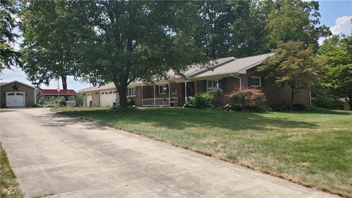 Exquisite brick and vinyl single family-owned custom built ranch. Front entrances has a covered porch. Step into your three-bedroom, two full bath home with original hard wood trim, crown molding, hard wood flooring in living room and hallways. This lovely living room features a wood burning fireplace, newer custom built bay window combined with a gally kitchen with breakfast bar. Many updates:- several newer windows with built in blinds, newer roof on main home, pavilion, shed with detached garage and workshop, newer furnace along with A/C, newer well along with newer septic and concrete drive 11 years young. First floor laundry room and pantry are right off the dining room. Stepping out the door from your living room you will find a lovely updated deck. Outside amenities include: covered pavilion, beautiful patio with fire pit, storage shed and one car detached garage and attached three car heated garage and workshop. Lots of storage. This unique home in a country setting is just waiting for you.