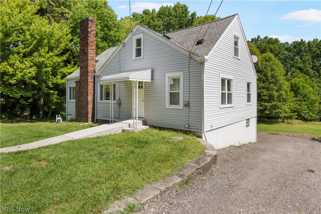 Make yourself at Home in this tastefully remodeled Cape Cod on 1.6+ Acres in Beautiful Tallmadge Ohio!! Enter from the rear deck and step up into the sun-lit Kitchen... Soft-Close Cabinetry, Sleek Granite Countertops and Luxury Vinyl Flooring almost overshadow the Brand New Stainless appliances. From the Kitchen, enter the Massive Living Room, complete with a Wood Burning Fireplace, whose hearth boasts it's own slab of Natural Granite. The Bathroom is a Show-Stopper, with a Ceramic Tiled Shower, new Fixtures and Vanity with a solid surface sink top. Your Master Bedroom and Bedroom #2 round out the 1st floor. Upstairs is an open hallway with the Jack and Jill walk-in closet for Bedrooms #3 and #4. Elevated rear deck in your Private Backyard offers a beautiful view and wildlife sightings in all 4 seasons. Mature Woods tower over the back 400' of this Property, Host a secluded bonfire or just set up a hammock and let the kids or pets roam. More updates than I can list & Priced to sell! Mo