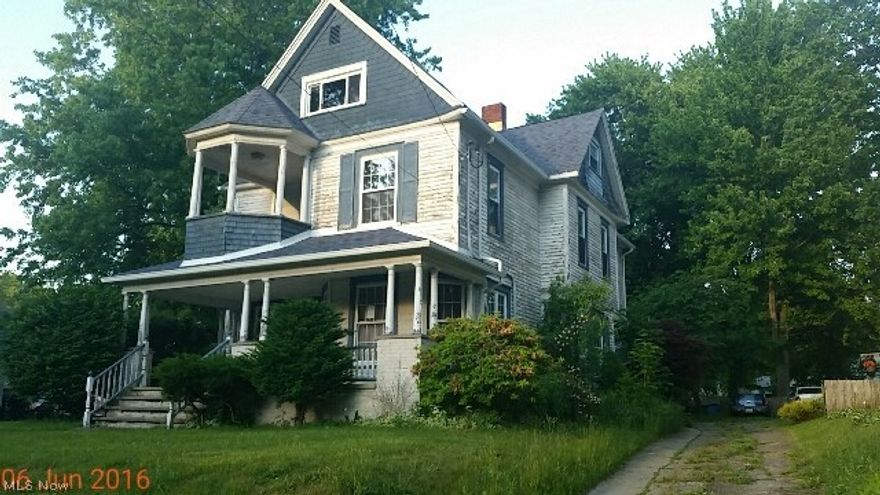 Huge old charming 4 bedroom colonial with big kitchen and dining room and living room and family room with beautiful natural woodwork and staircase and detached garage.