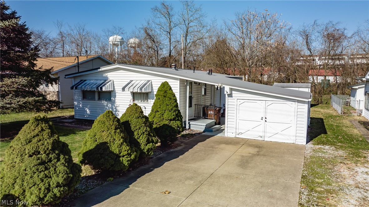 Looking to down size, wanting one floor living, wanting a rental property. Perhaps this home will be the end of your search. This property fits a lot of needs, Updates include a new furnace and AC in 2020, new metal roof in 2014. Home is clean as a pin with wonderful level backyard and covered porch to enjoy. No worries of high utilities' for this cozy cottage like home gas and electric bills when combined average around $100 a month, both summer and winter. The handy storage building has electricity and a nice workbench. it is perfect for doing projects. The garage also is clean as a pin. Come take a look at this low maintenance home.