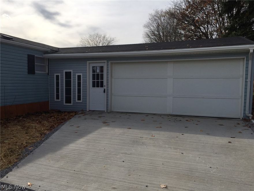 A spacious Ranch sitting on a 1/2 acre lot has 3 Bedroom and 2 full Baths.  Updates galore in 2015:   new appliances to include washer & dryer, freshly painted, vinyl flooring and carpeting, both bathrooms updated, all the gutters replaced, down spouts have been rerouted and extended, sump pump, wrap around deck was refurbished, concrete floor in garage and extends to the drive-way, concrete sidewalk to side entry door, graveled drive-way, exterior doors and septic & well have been tested and approved.  Spacious eat-in kitchen with tons of cabinetry opens into the Living Room with vaulted ceilings, great natural light and bead board trim.  This split bedroom floor plan is ideal with two bedrooms and the main bath at one end and the other end hosts the Master Bedroom with two closets and a private bath with a walk in shower.  First floor laundry room conventionally located off the kitchen.  The expansive Family Room overlooks the backyard and access to the wrap around deck.  Partial wal