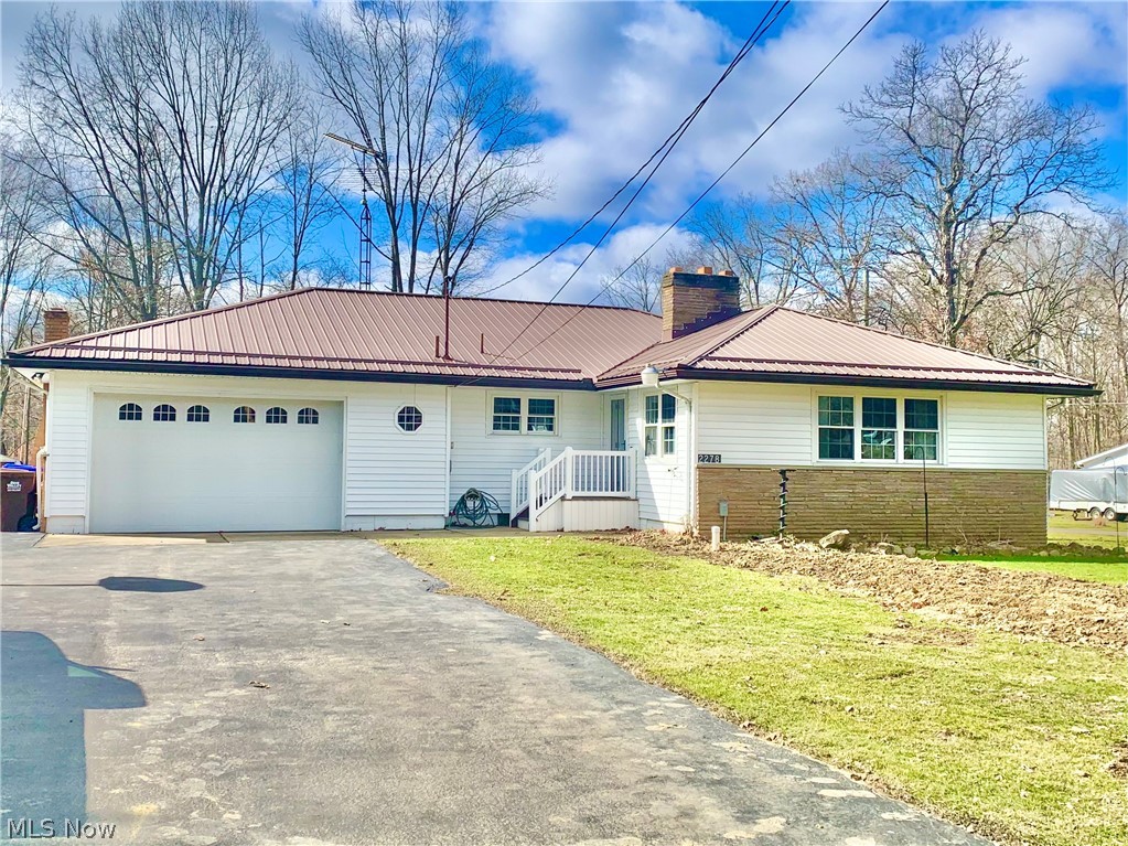 Nice 3 Bedroom 2 Bath Ranch. Newer windows, vinyl siding and metal roof. Large living Room, Den/Family Room. Hardwood floors in most rooms. 2 car attached & 2 plus car out building. Corner lot Approximately 1 acre. Septic was just installed. City Water.