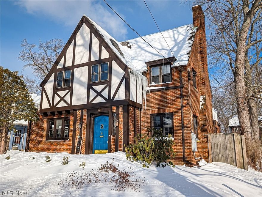 Welcome Home to 931 Amelia! This classic and timeless 4 bedroom 3 bathroom ALL Brick Colonial in one of West Akron's historic neighborhoods. A perfect blend of convenient and modern updates and original details will make this house one you will proud to call HOME. Welcome your guests in through the front door and immediately the history and charm begins. Original custom woodwork, glass door knobs and leaded glass are just a few of the details. Incredibly crafted crown molding and a gorgeous fireplace anchor this light filled and spacious living room. Flowing seamlessly to either the dining room or kitchen, this floor plan offers so much convenience for entertaining or family gatherings. All NEW Kitchen with soft close cupboards, stainless steel appliances and Quartz counters. A dedicated office with crown molding and leaded glass built ins, and a updated and convenient half bathroom finish off this 1st floor. Up the beautiful staircase to the 2nd level offering 4 very spacious bedrooms including a master suite with full bathroom and walk in closet. Another beautifully updated full bathroom with custom inlay tile serves the other 3 bedrooms. A timeless "Juliet" balcony is a great place to enjoy your morning coffee or evening nightcap. Most of the hardwoods have been refinished. NEW Furnace in 2025. The driveway is shared, but the attached garage and detached carport ensure plenty of parking. Plus, enjoy the added convenience of a basement accessible from both the house and garage.