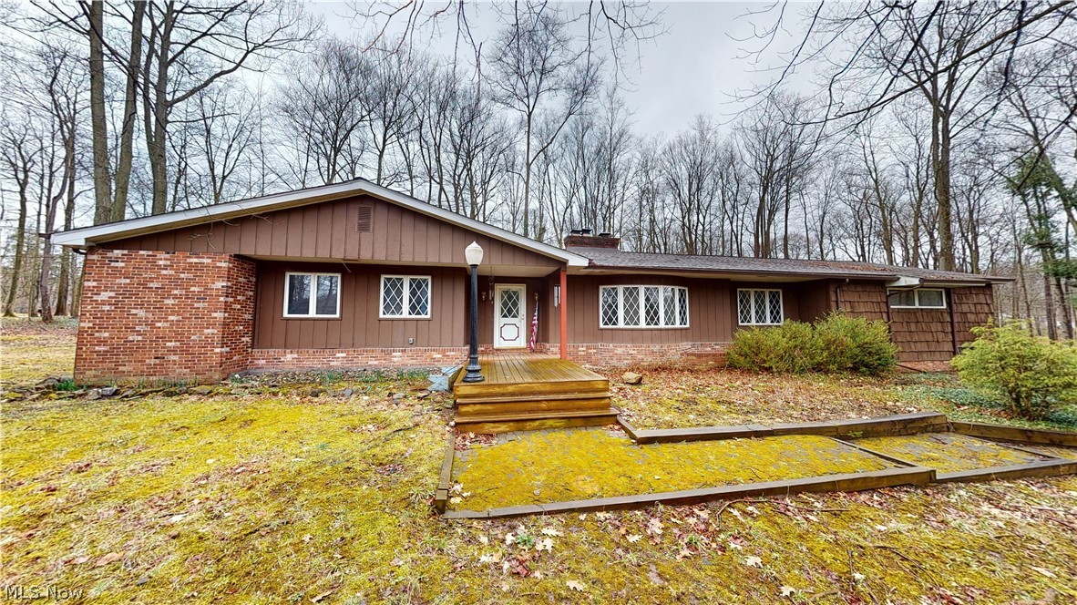 Welcome home to one floor living with this charming ranch located on 1.3 wooded acres in Aurora. A perfect blend of quiet country living but close to the city and all your favorite amenities. With 4 bedrooms and 3 full bathrooms, this well-maintained home is just waiting for you to apply your own personal touches to make it your own. The main living area features two comfortable family/living room spaces each with a fireplace/woodburner. There is also a 3-season room with beautiful wrap around view of the wooded property. The large two car garage has plenty of space for storage and parking and leads right into your oversized laundry room. The basement is partially finished with separate exercise room, storage or bonus room with built in shelving, Recent updates include: New Hot Water tank (2021), new boiler (2023), New well pump (2018), new water softener (2023), new roof including completely replaced decking (2020), and new gutters/downspouts (2020). Outside the property includes a small pond, a sturdy storage shed, raised bed gardens, and an invisible dog fence. The well and septic were just cleaned last year.