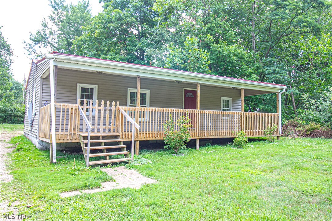 Cozy, well maintained home on a partially wooded lot. Public water and sewer. Gas heat. Many upgrades over the years, including hickory cabinets and newer appliances in the kitchen. Very inviting front porch and a large back yard for entertaining. Last house on a dead- end street.