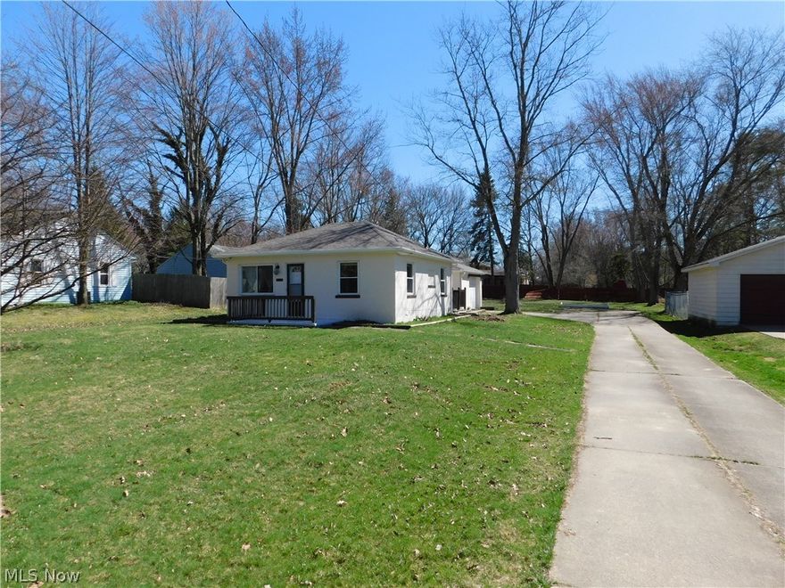 Updated ranch on almost half an acre lot in Munroe Falls! Enjoy your yard with bonfires and plenty of room to roam. Brand new roof, newer windows, and fresh paint inside and out. Relax on your deck and breezeway area that also leads to the garage. Conveniently located near the metro parks, golf, restaurants, shopping, entertainment, and much more. This is one floor living at its best.