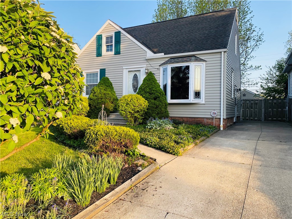 This home shows a lot of love over the years. Well-cared for and always well-maintained by longtime owners. Gorgeous, lush landscaping front and back. Sliding doors lead to Beautiful, spacious deck allows for morning cups of coffee and evening relaxation. Oversize 1 car garage. Updated kitchen with custom cabinetry, stainless steel appliances, garden window, ceiling fans and dining area. Updated bathroom. Partially finished basement with glass block windows. Newer windows, HVAC, Electrical and more. This one will get everyone's approval! Close to shopping, dining, park systems and easy access to highways. Less than 15 minutes to downtown Cleveland. Taxes are estimated.