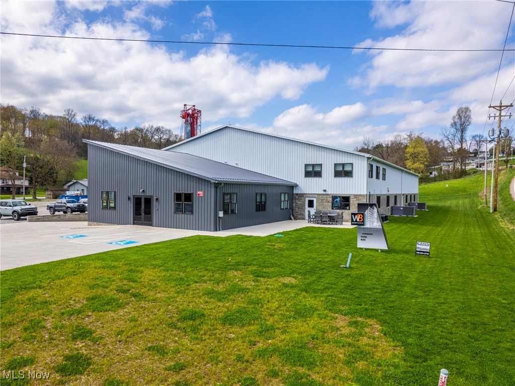 Commercial buildings in Trail with tons of potential. The main building was built in 2021 and has over 13,500 sq ft of office/warehouse space. The front door open up to a large foyer/waiting area with 4 offices and conference room with community workspace making up the front portion of the building. Then you will find mens and womens restroom, large kitchen and lunch room, and storage/utility rooms. The remaining portion of the building is over 10,000 sq ft with additional offices and warehouse/manufacturing space. Building has 2 loading docks, and 2 additional overhead doors, 3 phase and fire suppression system. Plans are approved for an addition of the same size to be built on if new buyer elects. The 2nd building is nearly 10,000 sq ft and is currently being used as storage. Owner had plans to build on to this building and a 10,000 sq ft pad is already in place in front of the building. There is restrooms, break room and office space with the majority being warehouse space. The 3rd building was 13 unit storage building that could easily be returned back to that and rented out. Currently being used for storage with 2 areas rented out. All of this sits on 4.388 acres. Buildings are hooked up to city water and there are two septic systems. This property sits in a thriving area and is a great opportunity for business or investment with room for expansion. Currently leased for 20,000 per month. Owner pays taxes and insurance.