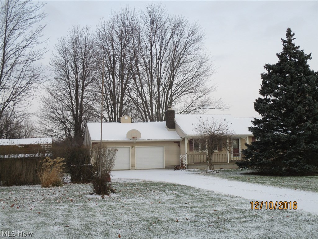 Country setting just north of town. Full basement could be finished for extra space. Large eat-in kitchen and oversized attached garage.