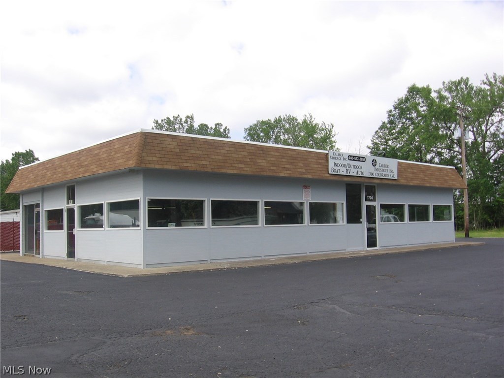 Completely renovated commercial building zoned light industrial with additional allowed uses of retail, auto, mixed use, storage and multi-tenant. It features 3 phase/480 400 amp power with all new LED lighting in showroom, production floor and parking lot. HVAC throughout whole building with recent upgrades to the A/C. Compressed air throughout with 3 overhead doors in production area and 1 in the showroom/office. Recent updates include new carpeting/flooring and paint inside office area with the whole outside of building completely painted in May, 2017. New chain link fence along back boundary of property with ADT security system with Revo security camera system and surveillance system with cloud storage for building and parking lot. Sale also includes tenants for Caliber Storage. Full Phase I and modified Phase II completed in 2015 with NFA required. Great opportunity for any business to obtain a first class building in a great location with good access to I90.