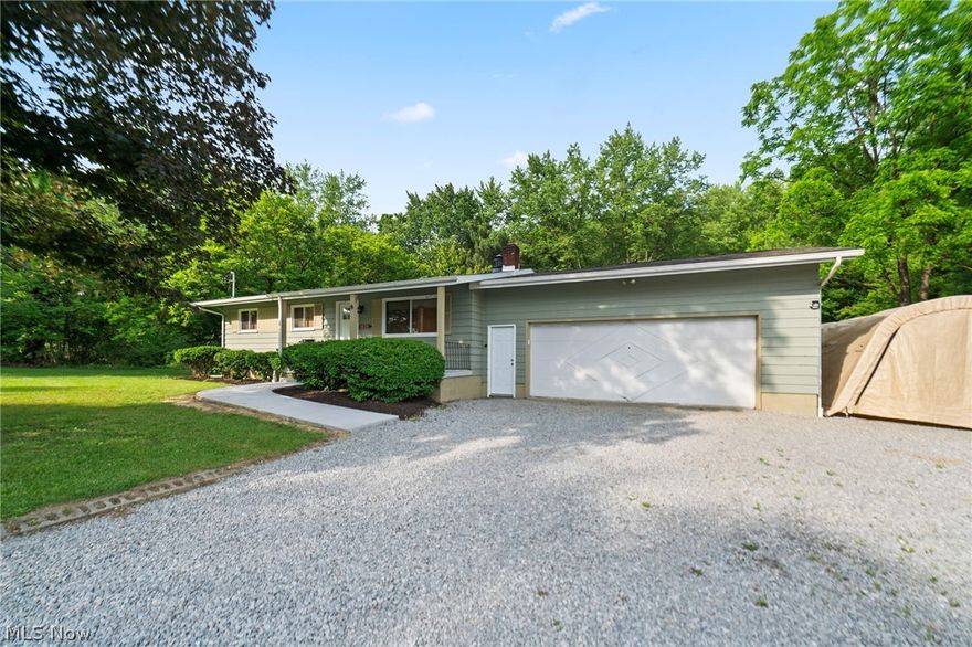 Discover this charming 3-bedroom, 1-bath home. Nestled on a generous 1+ acre lot, partially wooded with abundant wildlife, this property offers the perfect blend of tranquility and convenience in the Newton Falls School District. The home features a full basement and an attached double garage, providing ample storage and functionality.

This home has seen significant upgrades in 2023, ensuring a worry-free lifestyle for its new owners. It features a new septic system, updated electrical panel (inside and outside service) with back-up generator outlet, and new plumbing throughout. The property also boasts a new asphalt roof, windows, and all-new interior and exterior doors. The basement has been waterproofed and equipped with a sump pump, and the hot water tank and water softener (Gordon Bros) have been replaced. New Air Conditioner 2023. Additionally, the well has been serviced, insulation has been blown in, ducts have been cleaned, and the fireplace has been serviced. Outdoor upgrades include a new composite deck, concrete slab, and sidewalk, as well as a new limestone driveway. Inside, you’ll find refinished hardwood floors, solid wood doors, and completely renovated bathroom and kitchen spaces, complete with stainless steel appliances.

This beautifully updated home, set in a peaceful and picturesque setting, is move-in ready and offers a rare opportunity to enjoy country living with modern amenities. Plus, the adjacent buildable lot is just under 3-acre is available for additional opportunities. Parcel Number #51-353000 MLS # 5044453 Don’t miss out—schedule your showing today!