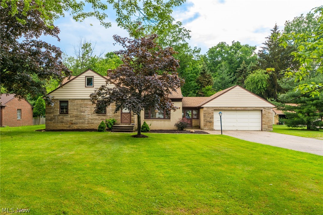 Don't miss this one-of-a-kind home in Seven Hills. It has had only one owner since being built in 1951, and features a beautiful addition built in 2007. Upon walking in, you are greeted by a large chef's kitchen with an open floorplan that spans into the living room area - complete with a large wood-burning fireplace. The main floor also features a family room, 3 nicely-sized bedrooms all with hard-wood floors, and a full bathroom. Upstairs, you will find a finished attic that currently features 5 small bedrooms and an additional full bathroom - this space could easily be converted into a larger bedroom or workspace. The property also sits on a very large lot for the area. Updates include: Tear-off Roof - 2010, Furnace 2007 -, A/C - 2007, On-demand HWT - 2007. Home is sold as is.