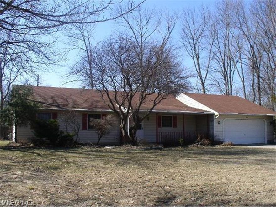 Enter through the Foyer of this fantastic open ranch with Lg. Great Room featuring shylights, woodburning brick fireplace and patio door that open to rear deck and yard.  Great room is also open to Kitchen with pantry, island and lots of room to eat-in.  Off Great Room is laundry room with 1/2 bath, entrance to large garage and access to backyard from laundry room and side access from garage.  Down the hall is a full main bath, 2 nice sized bedrooms and the master bedroom suite with skylights in dressing area, large walk-in closet and separate shower and toilet area.  Another feature of this home is a storage area in the hall closet that has the furnace and hotwater tank.  There are 2 additional parcels that go with this property to make a picture perfect home.