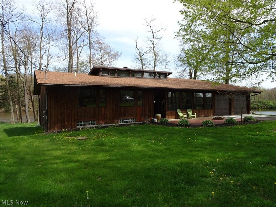 Living on the lake EQUALS Happiness! What views to wake up to everyday!! This Beautifully renovated 4 BR, 3 BA home is located on a private Pleasant Valley Lake. From the Brand New Kitchen and Baths (Cabinets, Granite Counter tops, Never used Stainless Steel appliances, New laminate flooring) to the Cathedral Ceilings throughout, This country home is truly "One of a Kind". Backyard decking runs the entire length of the house and can be accessed through the master bedroom as well as the great room. 4th BR (with walk in closet and full bathroom) and Family room (with woodburning fireplace) are in the lower level which walks out to the backyard patio. If you love to kayak, canoe, or fish, you will especially LOVE this house! Don't wait !!!