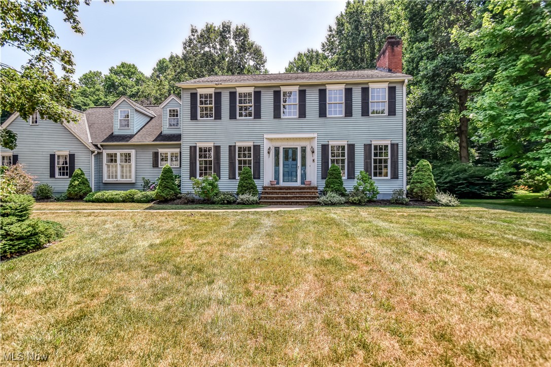 Charming and spacious, this 3,000+ sq ft center hall colonial sits on a peaceful .75-acre lot in a quiet, established neighborhood. Built in 1977, this well-maintained home offers timeless character with many updates throughout. The home features three fireplaces—located in the living room, family room, and primary bedroom—adding warmth and ambiance to the generous living spaces. The updated eat-in kitchen boasts wood-like vinyl tile flooring, Sub-Zero refrigerators, and updated counters with calming yet cheerful blue cabinets and an artsy stainless steel hood, making it perfect for everyday living and entertaining. While hosting serve your guests from the wet bar niche in the family room. A first-floor study with an adjacent full bath offers flexible living options, ideal for a guest room or in-law suite. Primary second floor bedroom is very grand with fireplace, vanity hall and walk in closet, and full bath. The other spacious bedrooms add function and ease to the layout, and a desirable location. Additional improvements include first-floor laundry with access to rear yard, newer furnace and air conditioner, a whole-house generator, resurfaced driveway, updated septic system, and refreshed lawn and landscaping. Split rail fence adds charming curb appeal to this home, while keeping it's integrity. The patio off family room is private and serene.The oversized two-car garage includes a loft for extra space. Don't wait this home is ready to make your own.