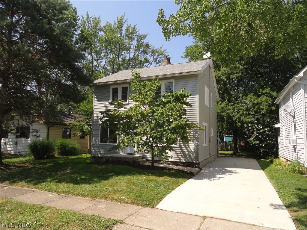 Beautiful 3 bed colonial with updates and charm inside and out. Great curb appeal from the new siding and new windows. Fresh paint and new flooring throughout entire home. Sparkling kitchen with new cabinets, countertops, flooring, sink, and fully applianced. Formal dining room is open to the kitchen and living room. The floor plan is great for entertaining and holidays. Bricked decorative fireplace and open stairway add character to the living room. Completely updated bathroom with new shower/tub, vanity, flooring, and lighting. All three bedrooms have fresh paint and new carpet. The back yard has a covered back patio with treed view and wood fence for privacy. New hot water tank and furnace. Updated electrical. Updated plumbing. This home is ready for you to move in and enjoy.