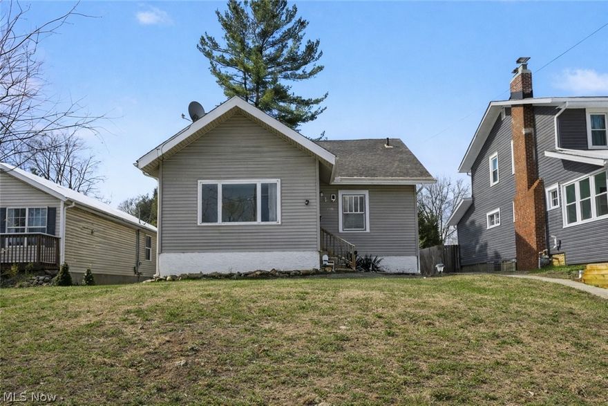Welcome to this charming two-bedroom ranch home for sale in Akron, Ohio, offering the convenience of one-floor living and a flexible layout designed for comfort and everyday functionality. Located near shopping, retail and highways, this property presents a fantastic opportunity for home buyers searching for ranch homes in Akron, as well as those looking for a well-maintained home in a convenient location.

Step inside through the inviting enclosed front sunroom, a bright and versatile space perfect for relaxing with a morning coffee, creating a cozy reading area, or setting up a home office. The home flows into a spacious family room featuring a classic wood-burning fireplace, creating a warm and welcoming gathering space for family and guests. Just beyond, the full-size dining room with built-in cabinetry offers both character and functionality while maintaining an open, connected feel ideal for entertaining.

The home features two generously sized bedrooms positioned on either side of the updated full bathroom, providing privacy and comfort. The spacious kitchen offers plenty of room for meal preparation and leads to an additional flex space near the back entry, perfect for a mudroom, pantry area, or additional storage.

Step outside to enjoy the private backyard  creating the perfect setting for relaxing evenings, outdoor gatherings, or gardening. The property also includes a detached garage, adding convenience and additional storage.
Recent updates include fresh paint throughout, and all appliances are included, making this home move-in ready for buyers looking for homes in Akron's Ellet neighborhood.

Conveniently located near shopping, restaurants, parks, schools, and major commuter routes, this property offers both accessibility and neighborhood charm.