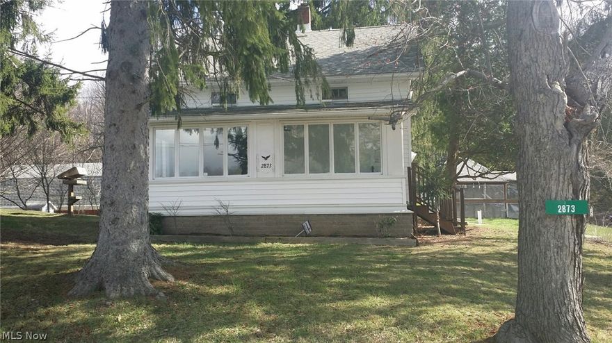 Beautiful farmhouse situated on nearly 5 acres.  If you are looking for serenity with the benefit of being minutes from the city this is your home.  This lovely 3 bedroom home has gorgeous new laminate flooring throughout most of the first floor, new carpet upstairs.  The spacious second floor bathroom has been completely remodeled.  The oversized master suite has a fireplace and walk in closet.  It also has geothermal heat, very efficient at an average of $170 per month total utility cost.  The land is wooded with very nice landscaping, large pond and an oversized barn/garage that will hold 3+ vehicles, the upstairs could easily be converted to an apartment or additional living area.  Call for your private showing today.  Mineral rights to do not convey with sale.  Recent appraisal at $175,000 not including second parcel of land over 2 acres.