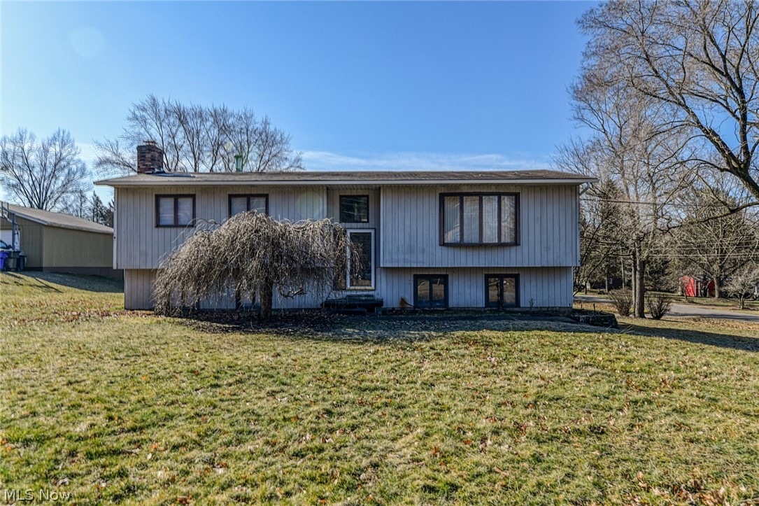 Looking for a 4 bedroom, 2 full bathroom home on a large lot? Then this home is a must see! It sits on over half an acre of land & provides you plenty of space for privacy. There is also a large deck & an additional patio! Walk inside to new vinyl plank flooring and fresh paint that continues throughout the entire main level. The large living room has a huge window that provides lots of natural light and is big enough for large furniture. The eat-in kitchen has classic white cabinets, newer gorgeous stainless steel appliances, and a breakfast bar. Off the kitchen is a formal dining room with sliding doors that give you access to the large deck. Down the hall are 3 nicely sized bedrooms with the new vinyl plank flooring. The spacious full bathroom has a double vanity sink and a jetted tub. Down to the lower walk out level is the large master bedroom, laundry room, second full bathroom. The master bedroom features a wood burning fireplace, brand new carpet and a huge closet! There is a b