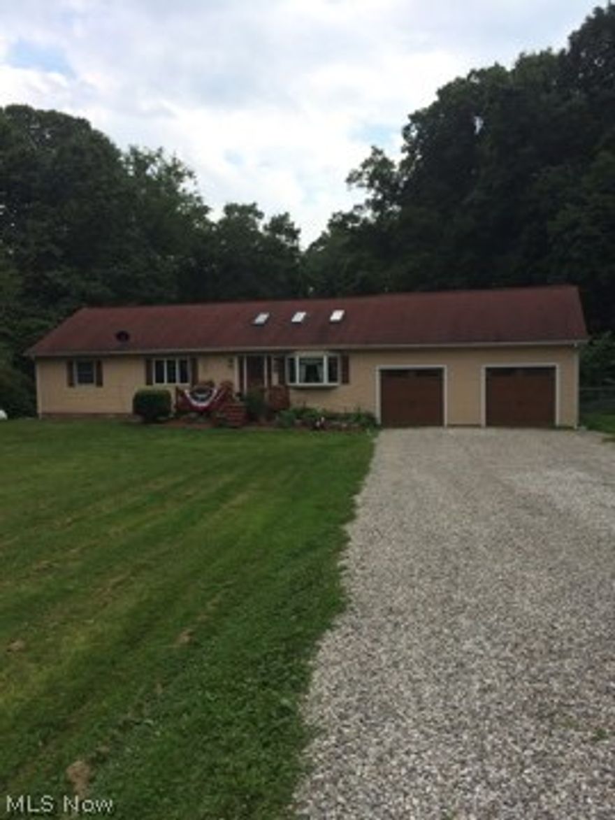 This is a perfect hobby property. A 5 stall knotty pine horse barn, 2 fenced pastures, and 1 unfenced pasture needs some horses or whatever your choice may be. Lots of good hunting, horse trails, beautiful mature trees and plenty of garden space. There is a lot of living space in this ranch home, 3 bedrooms, kitchen/dining room, open to living area, and a full bath on first floor.Newer french doors lead to back deck with a jacuzzi in the fully fenced back yard. The basement is finished and offers a great room, master bedroom, full bath , laundry, and a room that is being used as an exercise room.,This could be bedroom # 5.  A 2 car garage is attached to the home,with a stunning newer garage door. There's room for 2 cars, lawn equipment, toys and more in this spacious garage., and yes storage. A newer roof, recent new door on basement walkout, newer granite counter tops and back splash. Many other improvements are still in progress, and the location is great.Ten minutes from Coshocton,