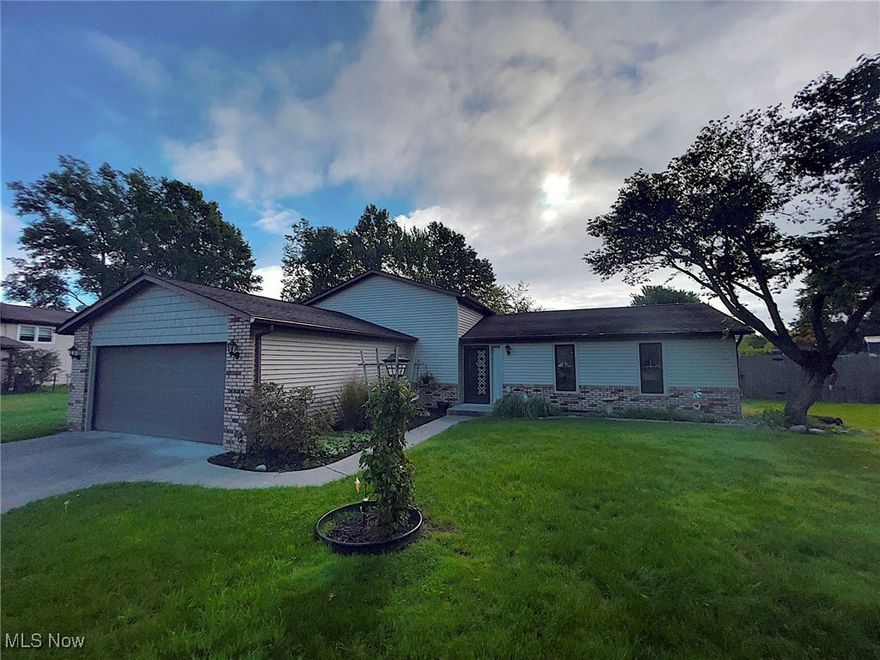 Welcome to this charming Split-Level home located on over a half-acre lot in Avon. This 4 bed 2 bath home features a main level with  spacious living, dining and kitchen with updated appliances. The eat-in kitchen area features sliding glass doors leading to the deck and backyard. The lower level offers a large, cozy family room with a brick, wood burning fireplace, wet bar, full bath, laundry room complete with washer/dryer and sink, fourth bedroom and direct access to the garage. The upper level includes three bedrooms and the second full bathroom with skylight. The expansive backyard offers a full perimeter fence, wood deck with built-in bench seating, a roof for shade and an additional two and half car garage. The home also includes newer windows, hot water heater, HVAC and an attached two-car garage with plenty of storage. The home has been meticulously maintained throughout the years and is ready for many more to come. Schedule your appointment today!