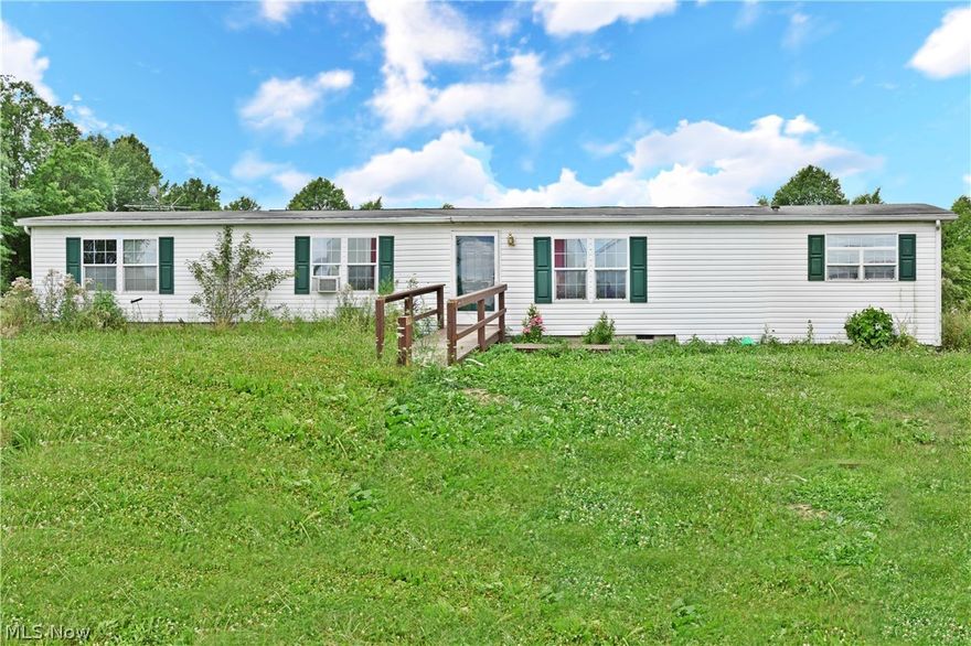 If you desire country living! Make an appointment to see country living in a spacious double wide manufactured house boasting over 1800 sqft of living space. A 24 x 24 deck off of the great room gives you great outdoor living space. The huge 32 x 40 garage can hold numerous vehicles, fun toys such as ATV's, dirt bikes or boats & maybe even tractors since you will be living in the country. All this is situated on 12.687 acres of land is waiting for you!
The seller will escrow (based off of a guaranteed quote) for a new septic system. The current system has failed the county inspection. The well water did pass the county inspection. The seller is not going to make any repairs or upgrades to the property except for the septic system.