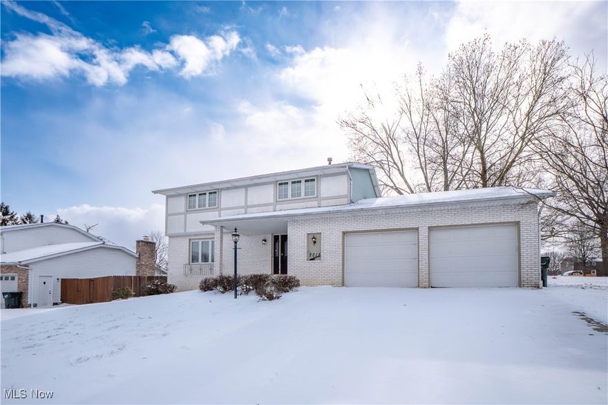 Welcome home to this beautifully updated 4-bedroom, 2.5-bath residence in Hunters Ridge, located within Plain Local Schools. This spacious two-story offers over 2,600 sq ft of finished living space, including a partially finished lower level. The main floor features new flooring throughout the welcoming foyer, the spacious living room, and the formal dining room with bay window. The eat-in kitchen with stainless steel appliances, island with cooktop, breakfast bar, pantry, and French doors leading to the patio. The cozy family room showcases exposed beams and a brick gas fireplace. Convenient first-floor laundry and half bath complete the main level. Upstairs, the primary suite offers two closets and a private bath with tile shower, plus three additional bedrooms and a full bath. The lower level includes a large rec room and bonus room ideal for a home office. Enjoy the backyard with a brick half wall, covered front porch, attached 2-car garage, and mature setting. Call today!