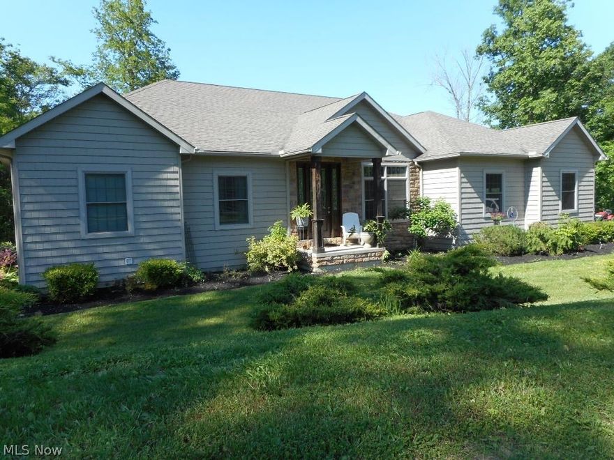 One owner custom built ranch with almost 3,400 sqft of living space situated on 13+ acre heavily wooded ravine lot in Midview School District. Open great room concept with cathedral ceiling, bamboo floor, custom maple kitchen with granite countertops, built-in oven, countertop range, commercial refrigerator, double sink, ceramic backsplash, ceramic floors, large island and a huge pantry. Large master suite with a glamour bath featuring tiled shower, jetted tub, double bowl sink and a large walk-in closet. The walk-out basement features a huge fifth bedroom, large bathroom, is plumbed for another kitchen and there is lots of space to finish your home theater room, man cave or rec room! There is a huge mahogany front door, 9' ceilings, 1st floor laundry room, 2.5 car garage and geo-thermal heating & cooling. This is a one-of-a-kind custom home for the nature lover!