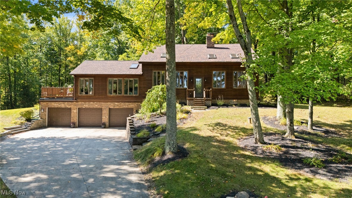 Well Maintained and Quality Custom Built Home nestled on 4+Private Wooded Acres! Secluded and set back off the cul-de-sac, this one-owner home offers great living space with 3 Bedrooms, 2 Full Baths, open floor plan with plenty of room to grow! Vaulted Living Room with tongue & groove wood ceiling, multiple skylights and 2-story stone wood burning fireplace. Eat-in Kitchen with abundance of cabinets, granite counters, all appliances stay including double oven & gas cooktop and open to Dining area. Huge Great Room with vaulted beamed ceiling, built-in oak bar and shelving, skylights, wired for 5.1 home theater surround, and french door to wood deck with SunSetter awning. 1st floor Bedroom plus Office/Bedroom with double-sided fireplace & slider to backyard. 2 Bedrooms on 2nd floor includes Spacious Master Bedroom with stone wood burning fireplace, double closets & private balcony access. Master Bath with double sink granite vanity, jetted tub & separate shower. 1st floor laundry. Unfinished basement with over 1200 sqft of potential living space for your family, currently used as workshop & storage. Central air. New Roof, new HWT & pressure tank in 2025. Concrete driveway with 3+car attached garage plus storage shed & steel outbuilding. Beautifully kept manicured yard and surrounded by mature trees, enjoy your personal sanctuary with peaceful views of nature & wildlife out every window or from the expansive deck & balcony. Just minutes to shopping, restaurants, schools, parks and easy freeway access!