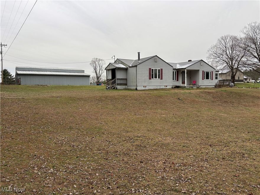 Welcome To The Ridge.  Located only minutes from Salt Fork State Park right off SR22 on Larrick Ridge is this 4.84 acres mainly pasture with a 50' x 36' horse barn with 8 stalls with a metal roof and siding.  Also, a 24'x24' garage (half of the floor is concrete) including two 12' x 24' Lean-To structures. Water faucets at both barn and garage.  Separate electric meters from house.  Outside security lights at house and garage.  The 1342 sq ft house features 2-3 bedrooms, full bath and two half baths.  Beautiful flooring.  Convenient laundry on first floor, as well as, hook ups in the walk out basement.  Large deck and covered Gazebo give great curb appeal to this home.  All appliances stay.  Seller will retain Mineral Rights.