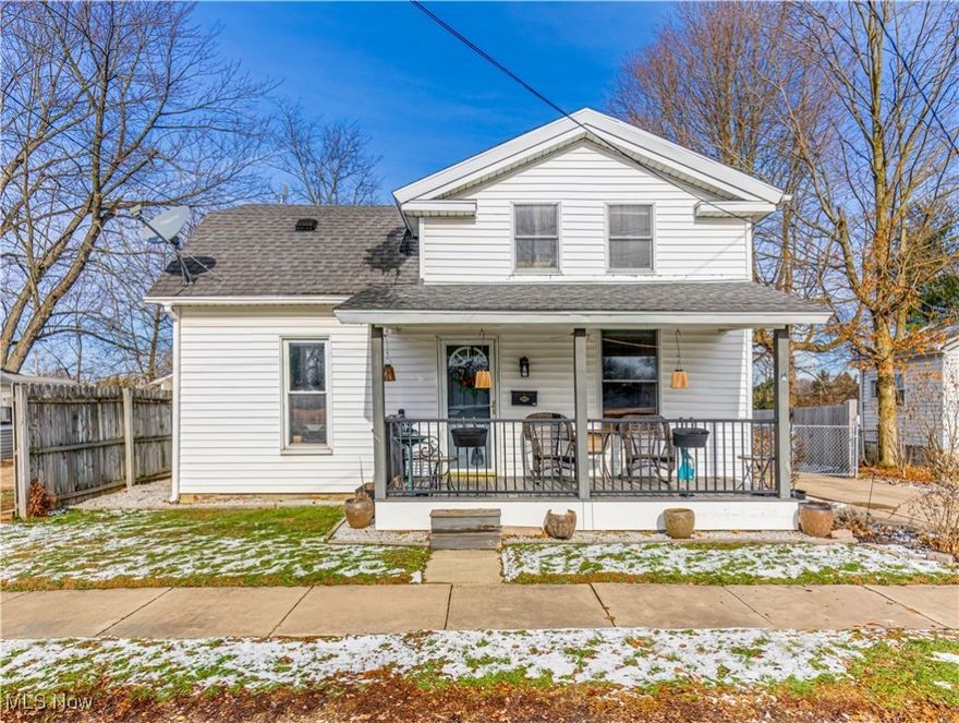 Welcome to 3889 Bradley Street - a lovingly maintained Cape in the heart of Mogadore with true pride of ownership * Enjoy an updated covered front porch *  Hardwood foyer that opens to a the living room with abundant natural light and updated luxury vinyl  flooring (2024) * The main floor offers a bedroom with double closet, a nicely updated full bath (shelve and towel holder will remain), and a kitchen upgraded circa 2002 with custom cabinetry, a large pantry that houses the microwave, granite countertops (2022), and luxury vinyl flooring (2022) *  Formal dining room features luxury vinyl flooring (2022), crown molding and two large windows *  An adorable breezeway between home and attached garage features  carpeting and a newer patio door (2024) leading to the patio * Gorgeous hardwood steps and wood/ metal railing lead you upstairs to two generous bedrooms; one with hardwood floors and a large walk-in closet across the hall; the other with luxury vinyl flooring and a good-sized closet * Basement includes washer/gas dryer and mechanical systems: furnace new November 2025, hot water tank ~9 years old. Older central air functioning well in summer 2025 *  Dehumidifier will remain *  Exterior highlights include an attached oversized 2-car garage with openers, fully fenced yard with wood privacy fence (chain-link along the west side and gate across the concrete driveway)  *  This lovely home is ready for a new owner so schedule your showing today!