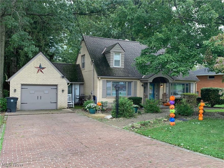 Charming 3 bedroom, 2 full bath Cape Cod with a finished lower level & a fantastic backyard! The backyard is partially fenced, great for children or pets & also includes a huge storage shed. Inside the home leads to a bright & cheery living room & dining room with loads of natural sunlight spanning the front of the home & hardwood floors. The large kitchen has been nicely updated with ceramic tile floor, newer backsplash, counters, sink, faucet & dishwasher. The main level is complete with a master bedroom & updated full bath. There are 2 bedrooms upstairs w/ample closet space. The lower level includes a finished rec room w/glazed tile floors & walls, a wood burner, great storage & a bathroom. An attached breezeway/sun porch separates the home form the 1.5 car garage. A brick driveway adds to the charm of this lovely home!