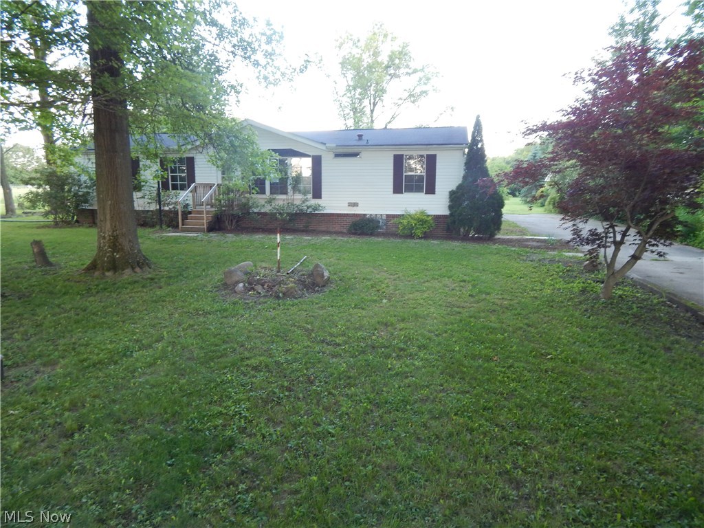 Yards of Yard! Enjoy the beauty of 1.58 Acres of country feeling. Near the city secluded away. Total updated 3 Bedroom 2 Bath Modular Home. Featuring Master Suit, full size basement and 2.5 car garage. First floor laundry room, vaulted great room and much more. Open floor plan concept, beautiful extended deck, shed and much more.Newly Renovated – Must See Home –Unique rare find in Ravenna with a quiet serene country setting surrounded by large mature trees on 1.58 acre. Renovations include: Interior remodeling, master and spare bath, air conditioning and furnace, water heater, kitchen sink/cabinet.
Home has a 2-1/2 Attached garage and a spacious sealed/water proofed basement with a detached storage building and a large deck overlooking back yard.
-Freshly painted, new “cottage feel” with new white bead board in main living/kitchen areas.
Come, see this home on 1.58 acres and finish designing it to your own personal taste.