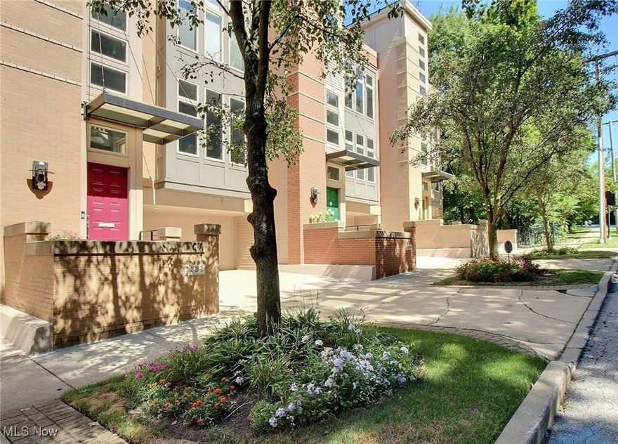 This stunning townhome offers modern living with spectacular city views overlooking Little Italy. Featuring 2 bedrooms, 2.5 bathrooms, and an open floor plan, the home blends comfort with style. Walls of windows frame sweeping views of the city. The sleek kitchen opens to the family room, and the formal dining room and family room share a dramatic see-through fireplace. A balcony off the kitchen extends the living space outdoors. Upstairs, the bedrooms are spacious, with the primary suite offering a second fireplace, a spa-like bathroom with a soaking tub and walk-in shower, and a generous walk-in closet. A convenient laundry room is also located on this level. The third floor includes a large open office and an expansive deck designed for entertaining, with incredible views of Little Italy and even Lake Erie in the distance. A private office is located separately off the heated two-car garage, providing additional workspace. Located in the heart of Little Italy, this home offers the best of Cleveland living, just a short walk to University Circle, CWRU, world-class hospitals, museums, and top restaurants.