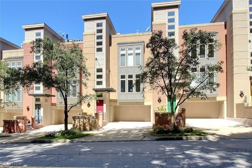 This stunning townhome offers modern living with spectacular city views overlooking Little Italy. Featuring 2 bedrooms, 2.5 bathrooms, and an open floor plan, the home blends comfort with style. Walls of windows frame sweeping views of the city. The sleek kitchen opens to the family room, and the formal dining room and family room share a dramatic see-through fireplace. A balcony off the kitchen extends the living space outdoors. Upstairs, the bedrooms are spacious, with the primary suite offering a second fireplace, a spa-like bathroom with a soaking tub and walk-in shower, and a generous walk-in closet. A convenient laundry room is also located on this level. The third floor includes a large open office and an expansive deck designed for entertaining, with incredible views of Little Italy and even Lake Erie in the distance. A private office is located separately off the heated two-car garage, providing additional workspace. Located in the heart of Little Italy, this home offers the best of Cleveland living, just a short walk to University Circle, CWRU, world-class hospitals, museums, and top restaurants.