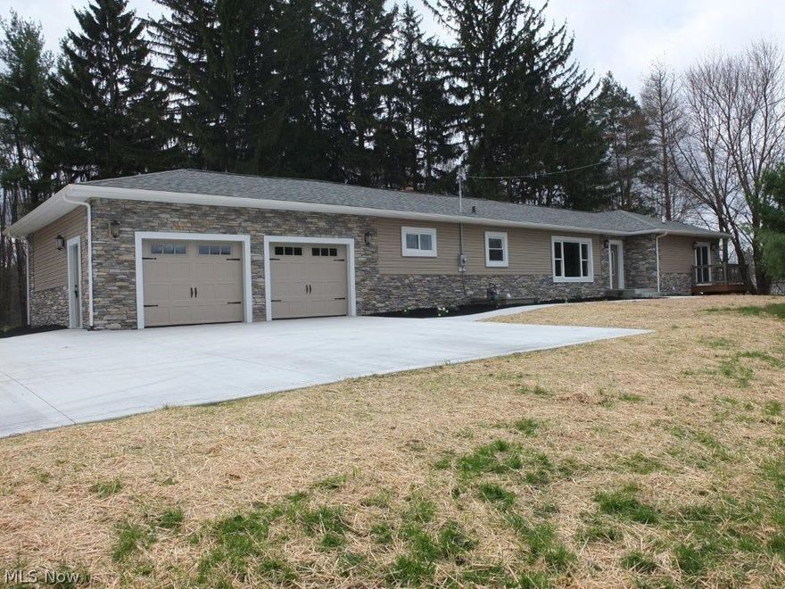 This is one amazing home! Everything has been done to this home in the last year...it's like a brand new home! 3-4 bedroom sprawling ranch with 3.5 baths and over 2,200 square feet PLUS the finished lower level which adds another 744 square feet. All of this on an over 2 acre very secluded lot. Stunning kitchen with vaulted ceilings, new cabinets, new stainless steel appliances, granite countertops, breakfast bar and ceramic tile floors! Kitchen opens up to huge dining area with tile floors and a family room with vaulted ceilings and a wood burning fireplace with a stunning stone and wood mantle. Master bedroom with walk-in closet, private deck and completely remodeled full bathroom with tile walk-in shower! All 3.5 baths have been gutted and remodeled exceptionally! The finished lower level has a 4th bedroom with look out windows, full bathroom, large recreation room with fireplace and tons of storage. All new in the last 18 months: Roof, furnace and A/C, hot water tank, insulation in