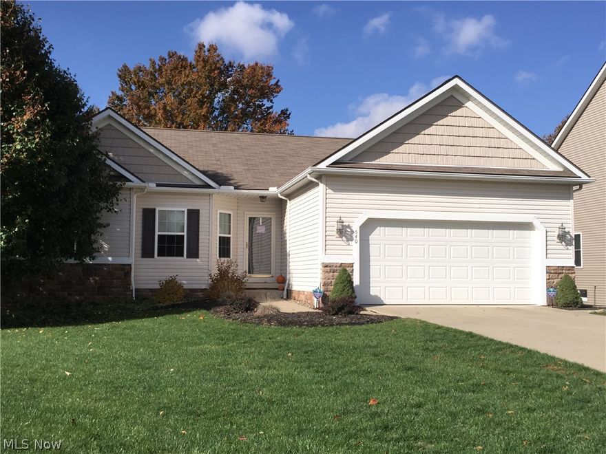 Pristine Ranch in Wadsworth!  Lovely 3 bedroom, 2 1/2 bath in The Vineyards at Old Mill.  Open floor plan boasts a kitchen with breakfast bar, large dining area and great room with gas fireplace.  Dining area and master suite both lead to deck overlooking private back yard.  Master suite has large bath with separate tub and shower, Two additional bedrooms plus an office or dining room offer plenty of space for family, guests, and entertaining. Finished walk-out basement with patio, half bath and lots of storage.  Newer carpet, freshly painted, security system and first floor laundry.