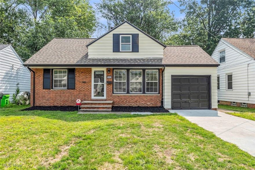 Welcome to this stunning 3-bedroom, 1-bathroom Cape-Cod home in Euclid, Ohio! The professionally landscaped yard and freshly painted siding with classic brick exterior create instant curb appeal! A brand-new concrete driveway and a fully fenced backyard with a shed provide style and functionality for outdoor living! Inside, enjoy fresh neutral paint, new light fixtures, and a seamless mix of refinished hardwood, plush carpet, and LVP flooring! The updated chef-inspired kitchen features two-toned cabinets, granite countertops, a bold deep-blue subway tile backsplash, new gold hardware, and stainless steel appliances including a gas stove, fridge, dishwasher, and microwave! Modern lighting completes this beautiful space! The bathroom has been fully updated with a quartz-topped vanity, gold fixtures, a new bathtub with custom tile, and a mirror with built-in LED lighting! The basement offers utility and recreation areas! The utility side includes freshly painted floors and walls, glass block windows, a utility sink, built-in shelves, and washer/dryer hookups! The rec side features LVP flooring, recessed lighting, glass block windows, and neutral paint—perfect for relaxing or entertaining! Additional highlights include central AC, an attached 1-car electric garage with epoxy-coated floor, and a new roof with 30-year shingles! Enjoy everything Euclid offers with nearby hotspots like Edgewater Park, Villa Angela-St. Joseph area dining and shopping, and Euclid Creek Reservation! This move-in ready home blends classic Cape-Cod charm with modern updates—schedule your showing today!