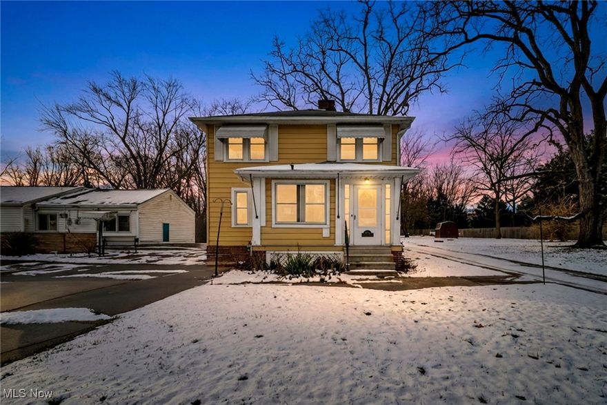 Welcome to this beautifully preserved and thoughtfully updated century home—celebrating over 100 years of timeless craftsmanship, architectural character, and refined modern comfort. Home Warranty included !

From the moment you enter, the natural woodwork, and original built-ins showcase the artistry of a bygone era, while new luxury vinyl plank flooring adds a seamless, contemporary touch. The warm and inviting living room features an original fireplace and opens directly onto the enclosed front porch—a perfect spot to enjoy your morning coffee or unwind at the end of the day.

The bright, light-filled eat-in kitchen with a charming breakfast nook offers both functionality and warmth, making everyday meals or weekend gatherings feel special. A formal dining room with classic built-ins and a large picture window , flows gracefully for hosting holidays and dinner parties.

Upstairs, you’ll find three generously sized bedrooms, including one with a unique walk-through closet that adds to the home’s original character. The newly renovated full bathroom brings fresh modern style, while the spacious main bedroom closet—rare for a century home—offers practicality without compromising charm. Additional hallway built-ins provide extra storage with character.

A full basement provides abundant storage, or future finishing potential, and the one-car garage includes an attached workshop plus a convenient stairwell leading to the attic—ideal for additional storage or creative use.

Outside, a turn-around driveway enhances ease and accessibility, while the home backs to private land on both the side and rear, offering peaceful, scenic views year-round. Nestled in beautiful Olmsted Falls, the property is surrounded by rich local history, small-town character, and community charm that make this area so beloved.

Lovingly maintained and updated, this century home offers a rare blend of history, comfort, and modern livability. Experience the charm—make it yours today.