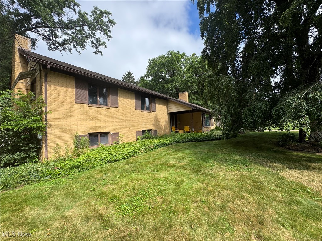 Journey over to the highly desirable location of 1452 Avalon Rd. and tour this sizeable, unique Split Level where you'll be pleased to find a great floor plan, large rooms and multiple fantastic features! Level one offers an awesome Living Room, adorned with eye pleasing built-in Oak cabinetry that surrounds a well placed Gas Fireplace, a great Dining area and a convenient kitchen that features character-enhancing chandeliers. The Master Bedroom is located on the 2nd level and provides all of the space you need for your bedroom suite of choice while Bedroom #2, quite adequate in size as well, offers a fantastic built-in dresser in the closet. Completing this level is a full Bathroom equipped with an efficient Jack & Jill sink laden vanity. Separated by an open "Study" area, Bedroom's #3 and #4 are located on the 3rd level, both of which feature sky lights. The entire 2nd and 3rd levels have updated flooring (2024) and paint. You'll continue to be amazed making your way to the lower level as you'll be greeted by an awesome 25x22 Family Room, clad with great built-ins, a second fireplace, new flooring (2024) and a full Bathroom w/Jetted Tub! Looking to enjoy the peacefulness of the back yard? Step out of the Family room and into the huge screened patio...rain or shine, this is a fantastic space in which to relax or entertain! Stepping down to yet another level of this well built home (5 levels total), you can let your imagination run wild as you discover a sweet kitchenette, attractive ceramic block walls and an overall clean zone. Both lower levels offer walkout access! Other bonus features include a great Mudroom area, 2-car Garage, Large Shed, fenced-in back yard, additional parking (cars/boat/RV, etc), large lot, mature trees & Central Vac System.