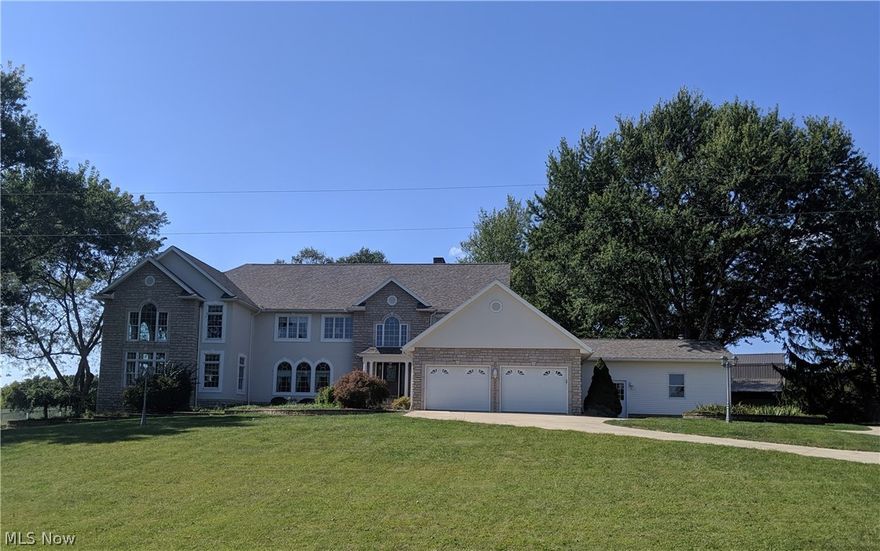 Welcome to this beautiful custom-built home that is located just North of Fryburg (East Holmes School District) and in a great neighborhood. The possibilities are endless with this home as it could be used as a Bed and Breakfast. Airbnb, Retreat Center or a family home.  The one owner home sits on 2.138 acres and will wow you with so many details! The first floor boasts a custom Mullet Cabinet kitchen and dining room with stainless steel appliances and hardwood floors, master suite with a walk-in tile shower, a formal dining room, family room, living room, 4-season sun room and a laundry room. The family room has two-story floor to ceiling windows and a stone gas fireplace. The second floor consists of 5 bedrooms, 4 full baths and a half bath. The lower level has a home theater, kitchenette, office area and a rec room with fireplace. The backyard offers a stamped concrete patio and two private decks. Other amenities include the two separate 2 car attached garages, a 32x44 bank barn wit