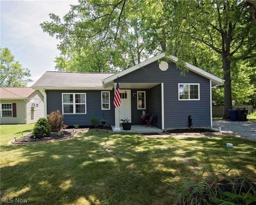 Why build when you can MOVE RIGHT INTO this stunning ranch home that has been completely taken down to the studs and built back up the right way just 2 years ago. EVERYTHING is just two years old! These upgrades will last for years. Electrical, Plumbing, Furnace, A/C, high efficiency tankless Hot water heater , Roof,  Windows, Drywall, Flooring, and Appliances.  The outside has gorgeous new maintenance free blue vinyl siding with a quaint front porch. Step into the spacious family room with vaulted ceilings. The kitchen is a Chef's dream featuring gorgeous espresso colored cabinets, granite countertops, stainless steel appliances, beautiful flooring, recessed lighting and a large island for seating. The bathroom features a spacious tub, vanity, flooring, beautiful fixtures. The whole home is painted in gorgeous neutral colors. This turnkey home also features a huge 3 parcel lot with partial fenced back yard. This home is just minutes away from Lake Erie recreation, shopping, schools an