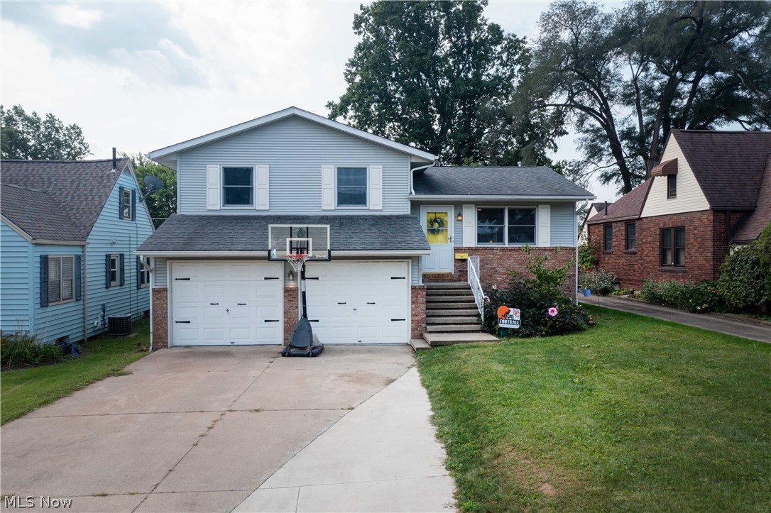 What a rare find this beautifully renovated home located in a quaint established neighborhood. As you enter you're greeted by high vaulted ceilings and a dreamy skylight that provides abundant natural lighting. The large kitchen (6x4) island and breakfast bar have been amazingly renovated with multi-tone granite countertops accented by subway tile, stainless sink, and cabinetry galore. Walkout to a deck and private backyard that is completely fenced with additional patio space for those cool September evening fires! The lower level provides a cozy great room that features a full bath and accessed to the rear yard. Within walking distance to shopping and restaurants and easy access to freeways, this home is full of current amenities that are found in much newer and higher-priced homes. The neutral décor and wonderful layout are ready for its new owner to move in and begin their life at this fabulous home.