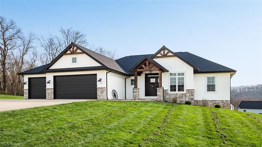 Welcome to this stunning custom-built ranch, completed in 2021, offering the perfect blend of modern style, thoughtful design, and functional living space. With 4 bedrooms and 3 full bathrooms, this home sits on 1.67 acres in the highly desirable East Muskingum School District. The heart of the home is the stunning kitchen, featuring quartz countertops, a stylish tile backsplash, gas stove, walk-in pantry, and custom Amish-built cabinets that showcase exceptional quality and craftsmanship. The open-concept living room boasts vaulted ceilings and an electric fireplace, creating a warm and inviting space for relaxing or entertaining. The main level offers a spacious primary suite with a walk-in closet, and gorgeous primary bathroom with a double vanity and modern tiled shower. For added convenience, the laundry room is located just off the primary bathroom. You’ll also find two additional bedrooms and a full bath on the main floor, along with a versatile office or flex space, perfect for working from home or a playroom. The finished walk-out basement expands your living space with 9+ foot ceilings, an additional bedroom, full bathroom, storage space and plenty of room for entertaining, relaxing, or hosting guests. The oversized three-car garage provides plenty of room for vehicles and storage, and is complemented by a functional mudroom/cubby area just inside the home to keep everything organized. Enjoy peaceful country living from the covered deck overlooking your property, ideal for morning coffee or evening gatherings. This move-in ready home truly checks all the boxes with quality craftsmanship, modern finishes, and a layout designed for everyday living.