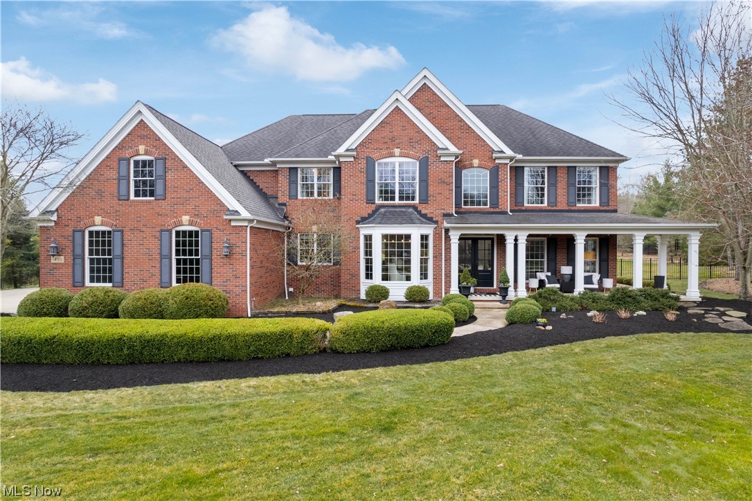 Welcome home to this beautifully updated home located on 2.2 acres in Hinckley's Estates of Ridgemont. Each room has been elegantly designed where you'll find details like bold colors, artistic wainscoting, plank ceilings, custom iron spindle stair rods & more. All the flooring has been completely replaced with a gorgeous red oak along with custom linen drapery and lighting throughout. There's a full bath with travertine flooring and marble shower with an adjacent, spacious first floor bedroom, perfect for an in-law suite. The grand living area features a fireplace, plenty of windows, and open to a stunning kitchen that flows into a morning room where the owner reconstructed the shape of the windows to offer a more modern ambiance. You'll appreciate the distinctive crown molding, Mullet Cabinetry, & honed granite counters. The island counter is of honed Vermont danby marble & all appliances are Thermador. The first floor laundry is conveniently located just in from the 3-car garage. Up