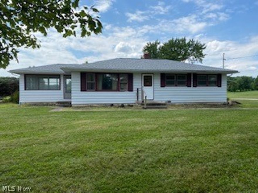 Beautiful Country property with 4.6 acres featuring a nice pond.  The home sits nicely atop a hill and has great promise.  This original 1950's home is being sold as is.  There are 3 bedrooms with hardwood floors, 1 functioning bathroom, 3 season room and partial basement.  The basement may require foundation work in the near future. Cloverleaf Schools and availability of the Cloverleaf Recreation Center for a fee. Public water available at street, tap in fee required.
There is a wonderful view of the pond and adjacent farmland from the back of the home.  With a lot of TLC, this home can be a gem!

The taxes reflect CAUV recoupment.